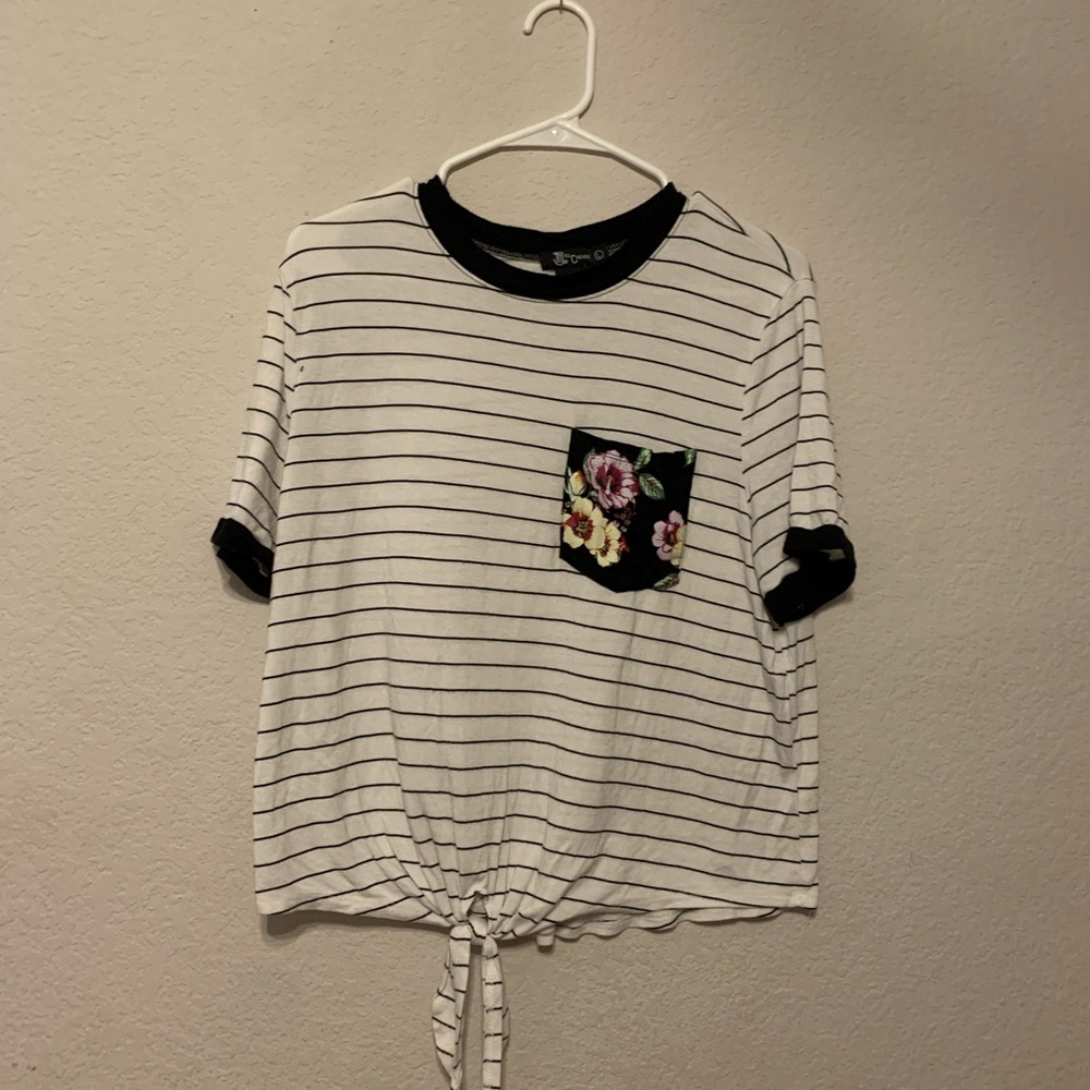 Black and white striped short sleeve shirt. Floral black pocket, large adult tee